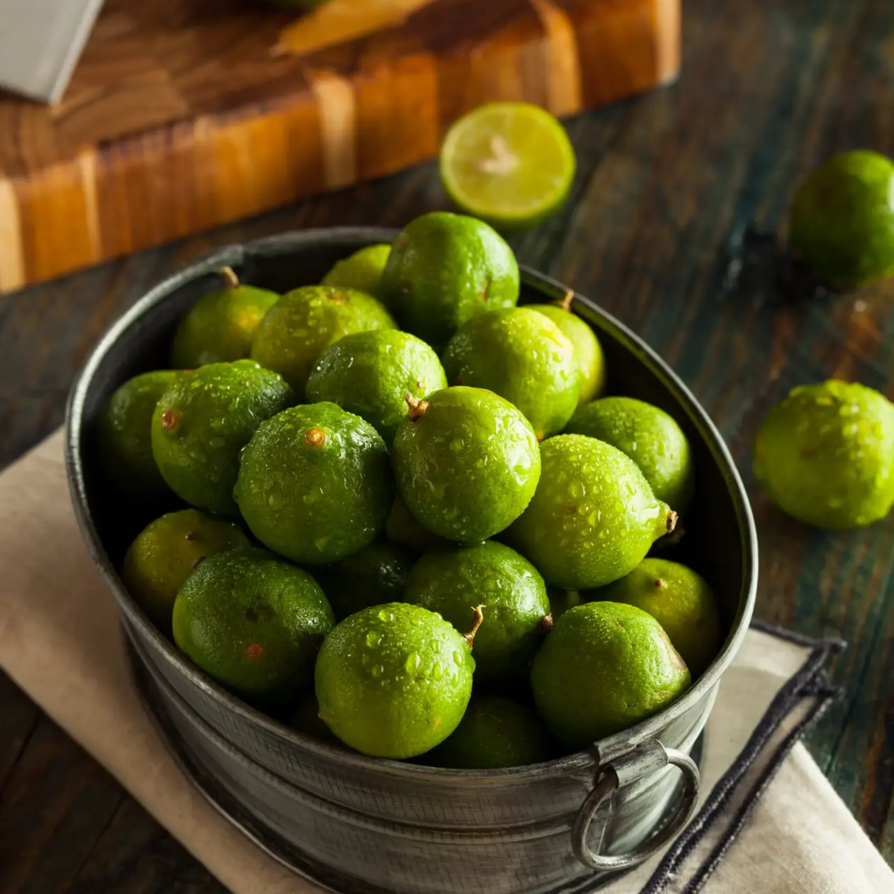 Raw Green Organic Key Limes in a Bowl